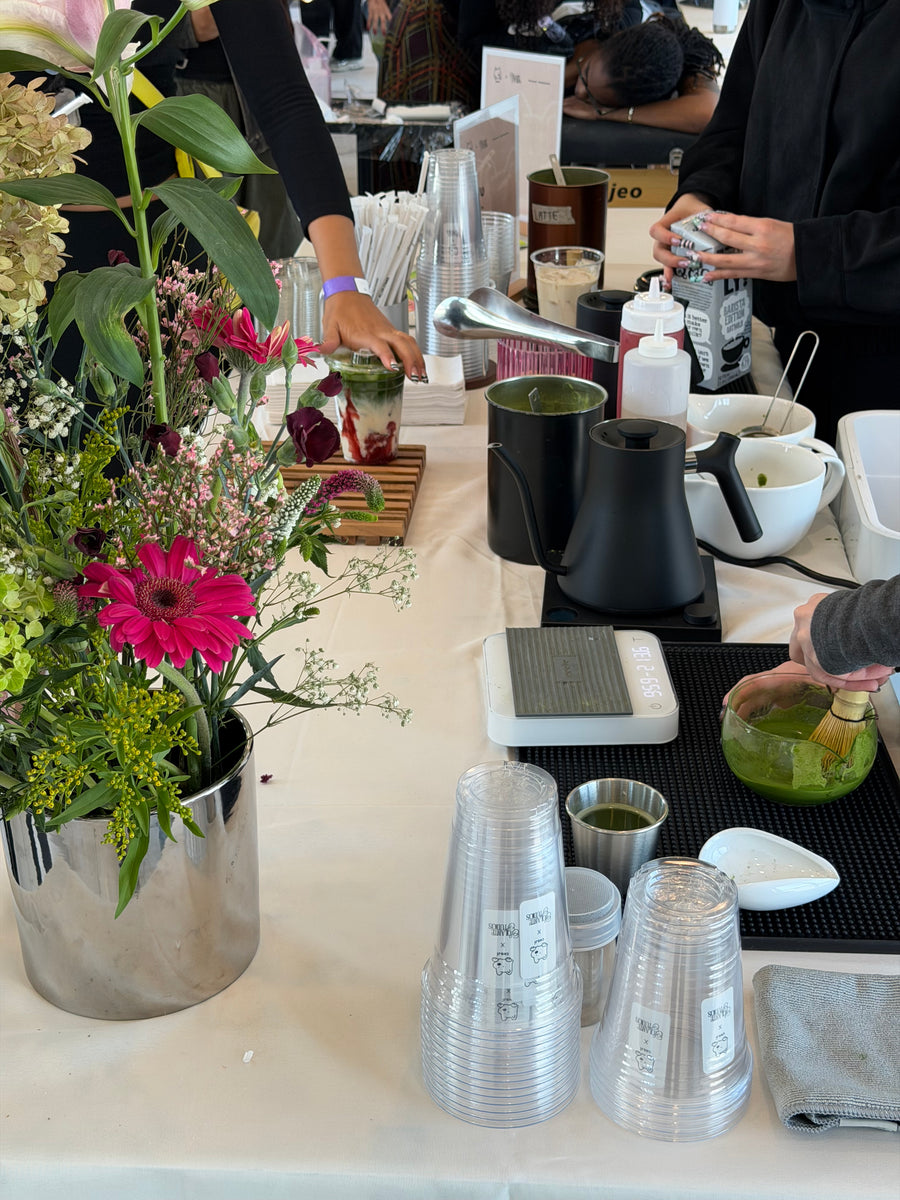 Choji team serving matcha behind the Solante pop-up bar